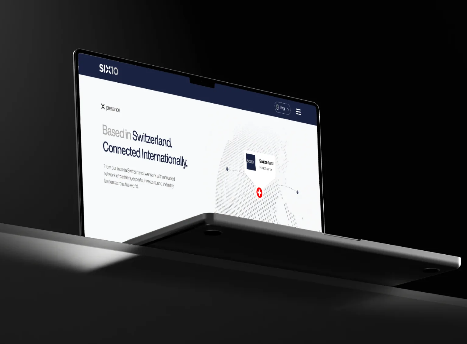 SIX10 media — laptop in dark room